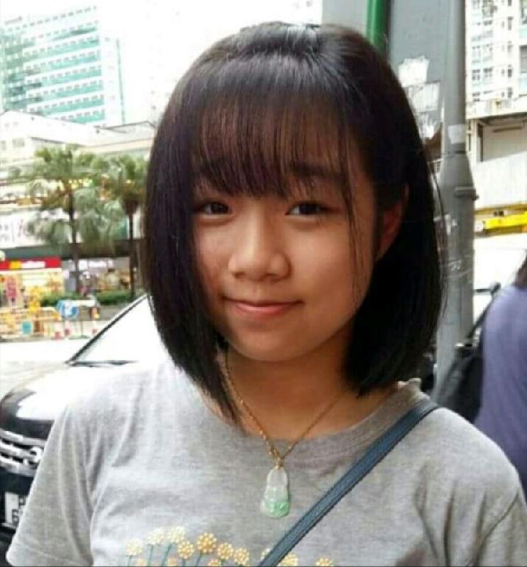 Missing girl Cheung Tsz-ching, aged 15, is about 1.63 metres tall, 54 kilograms in weight and of medium build. She has a long face with yellow complexion and long straight black hair. She was last seen wearing a long-sleeved shirt with brown and white horizontal stripes, white skirt, and white sports shoes.