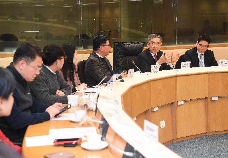 The Secretary for Financial Services and the Treasury, Mr James Lau (second right), meets with the Chairman of the Wong Tai Sin District Council, Mr Li Tak-hong (third right), and other District Council members to exchange views on various district issues today (February 7). Accompanying him is the Under Secretary for Financial Services and the Treasury, Mr Joseph Chan (first right).