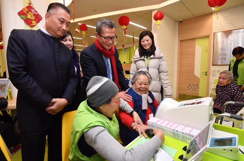 The Financial Secretary, Mr Paul Chan (third left), today (February 7) visits the Po Leung Kuk Lau Chan Siu Po Elderly Centre. Also present are Vice Chairman of the Po Leung Kuk Dr Margaret Choi (second left) and the Chairman of the Kwun Tong District Council, Dr Bunny Chan (first left).