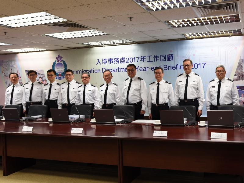 The Director of Immigration, Mr Tsang Kwok-wai (fifth right), chairs the press conference of the Immigration Department's year-end review of 2017 today (February 13).