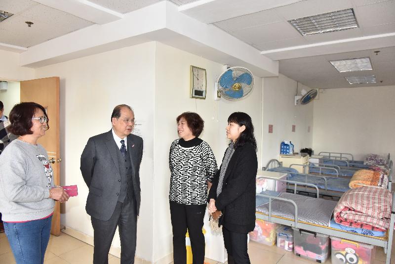The Chief Secretary for Administration, Mr Matthew Cheung Kin-chung (second left), visits a rehabilitation centre under the Bought Place Scheme for Private Residential Care Homes for Persons with Disabilities today (February 14) and tours the facilities.