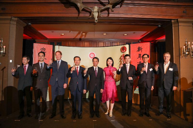 The Hong Kong Commissioner for Economic and Trade Affairs, USA, Mr Clement Leung (centre), and the Director of the Hong Kong Economic and Trade Office, New York (HKETONY), Ms Joanne Chu (fourth right), lead a toast to a healthy and prosperous Year of the Dog at the Chinese New Year reception of HKETONY on February 22 (New York time). Other guests are the Head of Investment Promotion of HKETONY, Mr Douglas Lee (first left); the Director of the Hong Kong Trade Development Council in New York, Mr Anthony Mak (second left); the Director, USA of Hong Kong Tourism Board, Mr Bill Flora (third left); the Permanent Representative of the Permanent Mission of the People's Republic of China to the United Nations, Mr Ma Zhaoxu (fourth left); the Deputy Consul General of the People’s Republic of China in New York, Mr Zhao Yumin (third right); the Chief Representative, New York Representative Office of the Hong Kong Monetary Authority, Mr Lawrence Cheung (second right); and the Chairman of the Hong Kong Association of New York, Mr Donald Moore (first right).