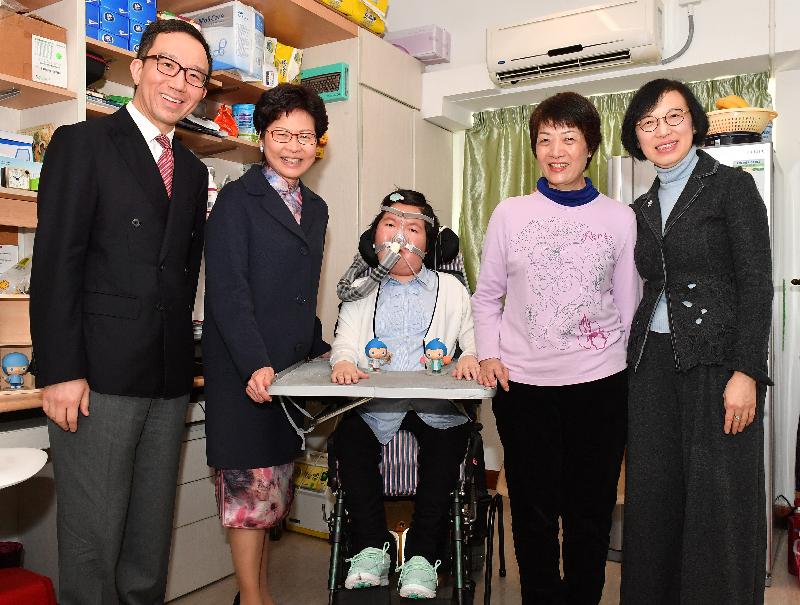 The Chief Executive, Mrs Carrie Lam (second left), accompanied by the Secretary for Food and Health, Professor Sophia Chan (first right), and the Dean of the Faculty of Medicine of the University of Hong Kong (HKU), Professor Gabriel Leung (first left), visited spinal muscular atrophy (SMA) patient Miss Josy Chow (centre) at a student residence at HKU today (March 1) to tell her about the latest developments of introducing a new drug for treating SMA in Hong Kong.