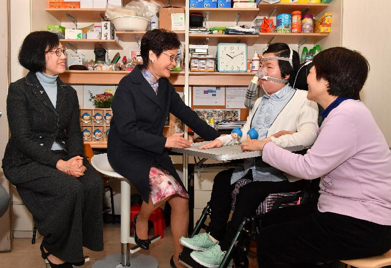 The Chief Executive, Mrs Carrie Lam (second left), accompanied by the Secretary for Food and Health, Professor Sophia Chan (first left), visits spinal muscular atrophy (SMA) patient Miss Josy Chow (centre) at a student residence at the University of Hong Kong today (March 1), breaking to her the good news that a new drug for treating SMA will be introduced in Hong Kong.