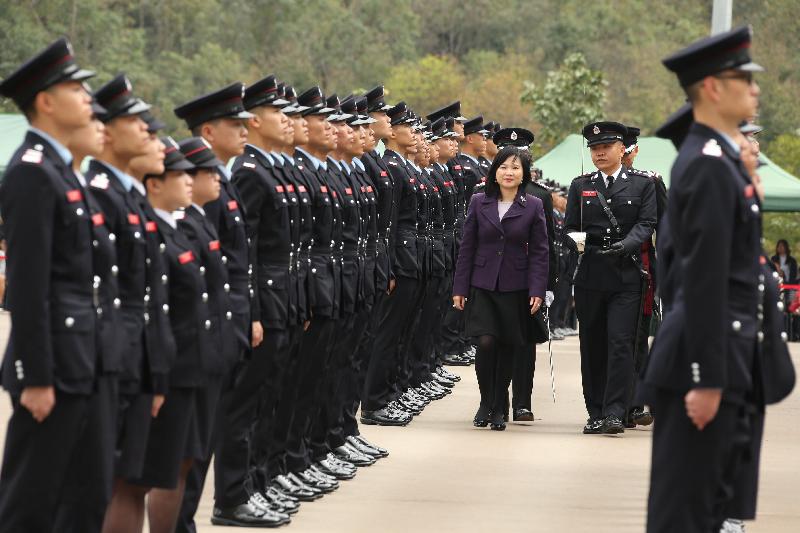 The Permanent Secretary for Security, Mrs Marion Lai, reviews the 181st Fire Services passing-out parade at the Fire and Ambulance Services Academy today (March 2).