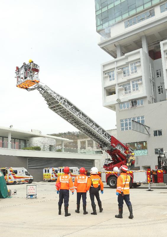 The Permanent Secretary for Security, Mrs Marion Lai, reviewed the 181st Fire Services passing-out parade at the Fire and Ambulance Services Academy today (March 2). Photo shows graduates demonstrating firefighting and rescue techniques.