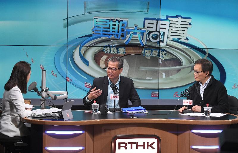 The Financial Secretary, Mr Paul Chan (centre), attends Radio Television Hong Kong's programme "Accountability" this morning (March 3) to answer questions on the 2018-19 Budget.