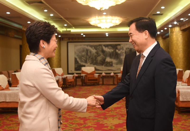 The Chief Executive, Mrs Carrie Lam, met with the Secretary of the CPC Guangdong Provincial Committee, Mr Li Xi, and the Governor of Guangdong Province, Mr Ma Xingrui, in Beijing today (March 4). Photo shows Mrs Lam (left) and Mr Li (right) shaking hands before the meeting. 
