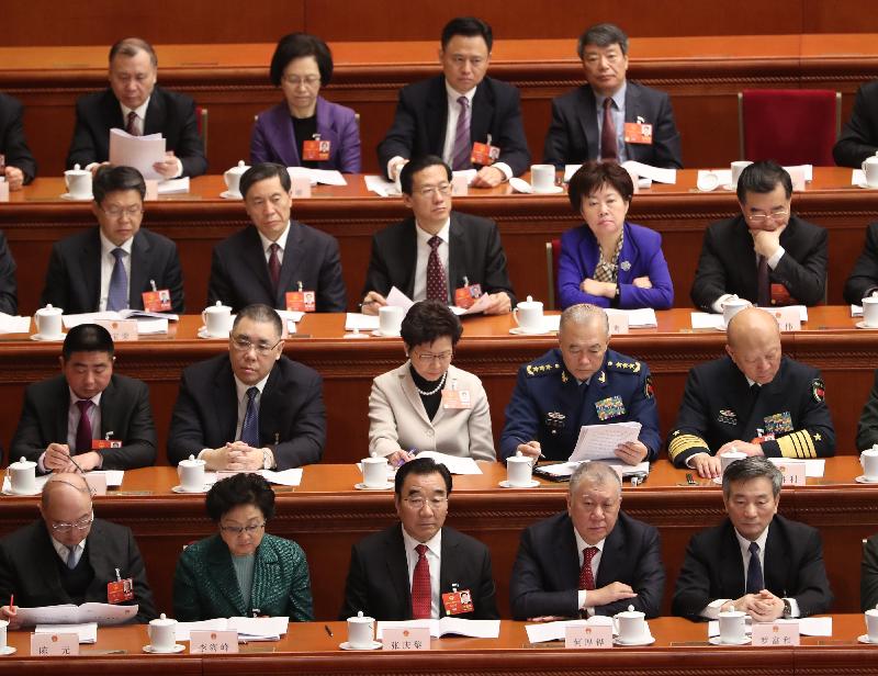 The Chief Executive, Mrs Carrie Lam (second row, third left), attends the opening ceremony of the first session of the 13th National People's Congress in Beijing this morning (March 5).