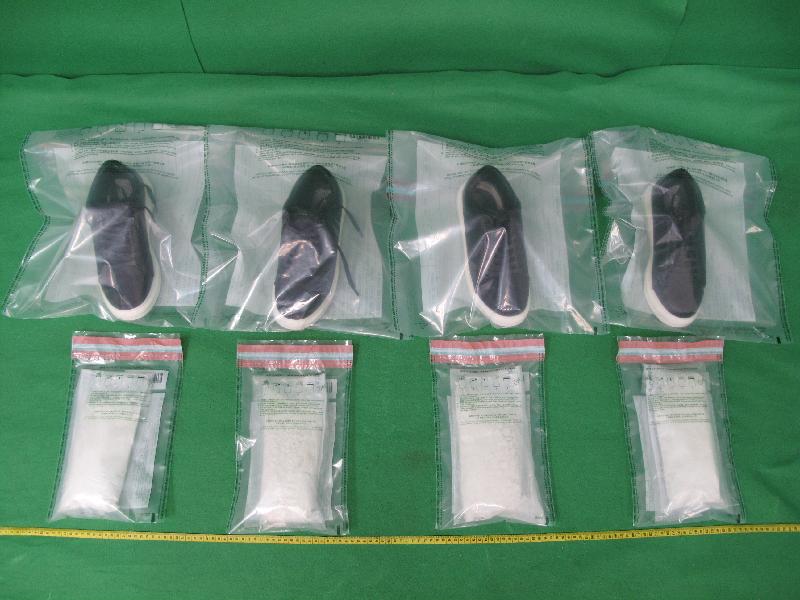 Hong Kong Customs seized about 1.4 kilograms of suspected heroin with an estimated market value of about $1.1 million at Hong Kong International Airport on March 11. Photo shows the suspected heroin and the shoes seized.