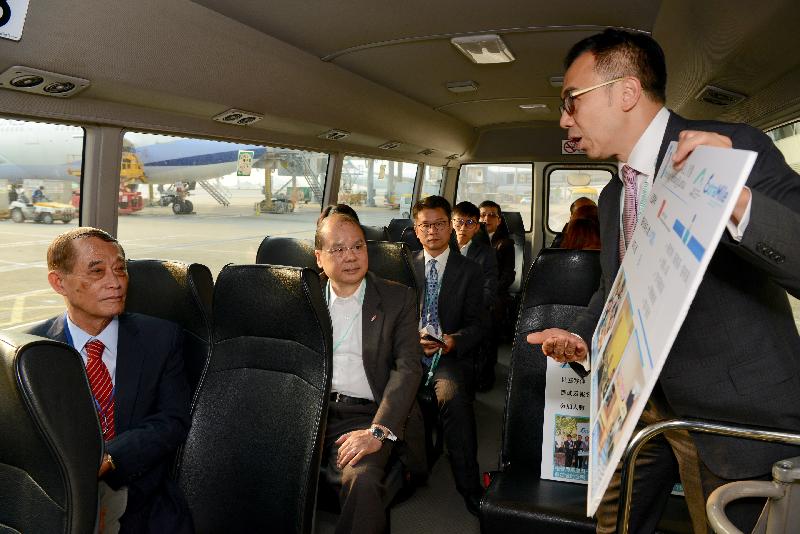 The Chief Secretary for Administration, Mr Matthew Cheung Kin-chung (second left), today (March 15) receives a briefing on Extra Mile, a community investment project of Hong Kong International Airport during his visit to the airport island. Also present is the Chairman of the Islands District Council, Mr Chow Yuk-tong (first left).