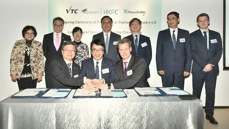 The Secretary for Innovation and Technology, Mr Nicholas W Yang (back row, centre), joins the Chairman of the Hong Kong Productivity Council (HKPC), Mr Willy Lin (back row, third right); the Executive Director of the HKPC, Mr Mohamed Din Butt (back row, second right); the Commissioner for Innovation and Technology, Ms Annie Choi (back row, third left); Deputy Chairman of the Vocational Training Council (VTC) Professor Eric Yim (back row, second left); the Executive Director of the VTC, Mrs Carrie Yau (back row, first left); and the Head of the Invention Center of Hong Kong, Mr Benny Drescher (back row, first right), to witness signing of the memorandum of understanding of Professional Diploma in Industry 4.0 between the HKPC, the VTC and the Fraunhofer Institute for Production Technology, Germany, today (March 22).