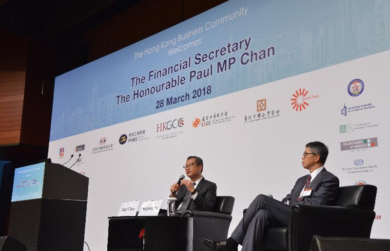 The Financial Secretary, Mr Paul Chan, attended the Joint Business Community Luncheon: 2018-2019 Budget today (March 28). Photo shows Mr Chan (left) at the exchange session. 