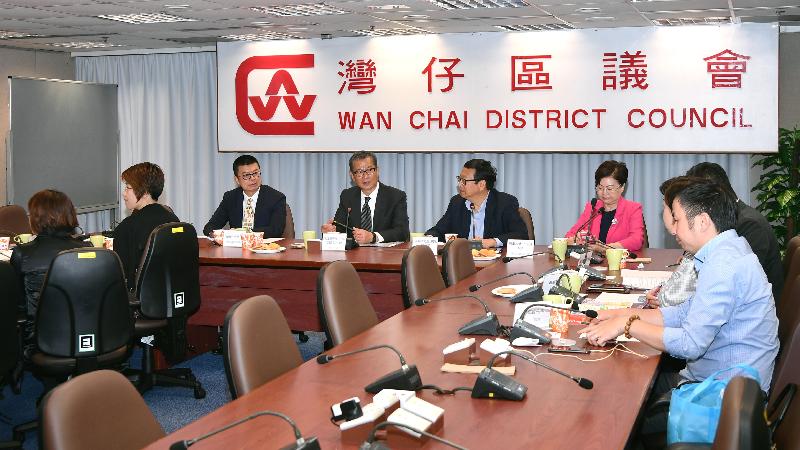 The Financial Secretary, Mr Paul Chan (second left), today (March 28) meets with members of the Wan Chai District Council (WCDC). Also present are the Chairman of the WCDC, Mr Stephen Ng (second right); the Vice Chairman of the WCDC, Dr Jennifer Chow (first right); and the District Officer (Wan Chai), Mr Rick Chan (first left).