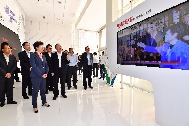 The Chief Executive, Mrs Carrie Lam, visited Hengqin New Area Exhibition Hall in Zhuhai today (March 30). Photo shows Mrs Lam (third left); the Secretary for Constitutional and Mainland Affairs, Mr Patrick Nip (second left); the Director of the Chief Executive's Office, Mr Chan Kwok-ki (first right); the Director of the Hong Kong Economic and Trade Office in Guangdong of the Government of the Hong Kong Special Administrative Region, Mr Albert Tang (first left), receiving a briefing on the Exhibition Hall.