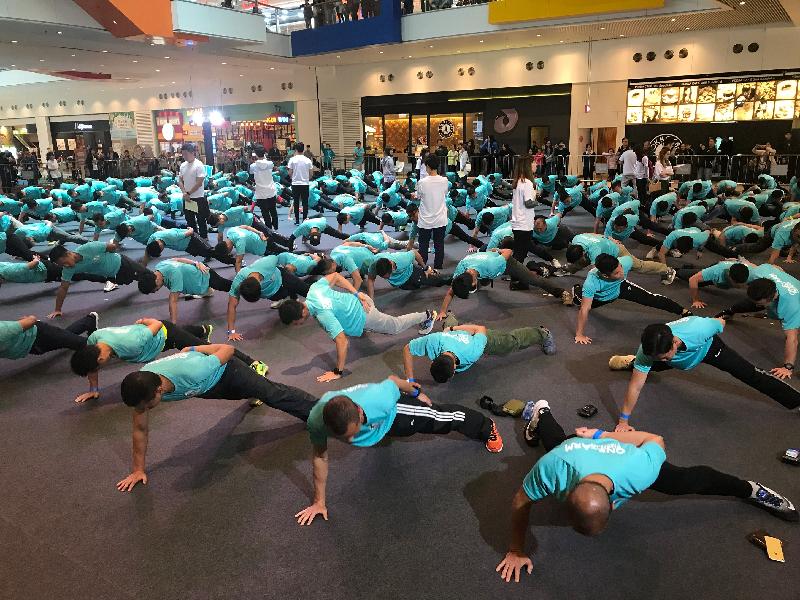 Three hundred members of Hong Kong Police Force and Auxiliary Police Force, and sports elites successfully set a record for the "Most people performing one-arm push ups" in the Guinness World Records.