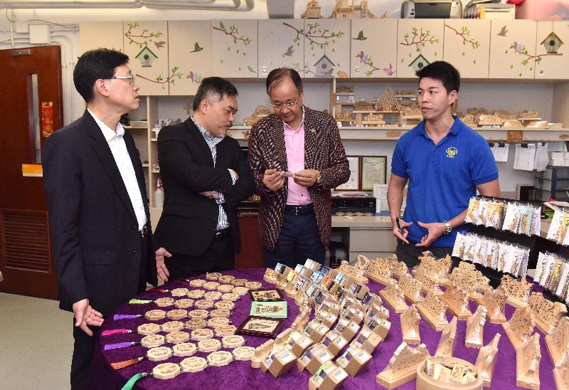 During his visit to Sai Kung this afternoon (April 18), the Secretary for Security, Mr John Lee (first left), accompanied by the District Officer (Sai Kung), Mr David Chiu (second left), and the Chairman of the Sai Kung District Council, Mr Ng Sze-fuk (second right), tours the Life Training Base of the Christian New Being Fellowship.