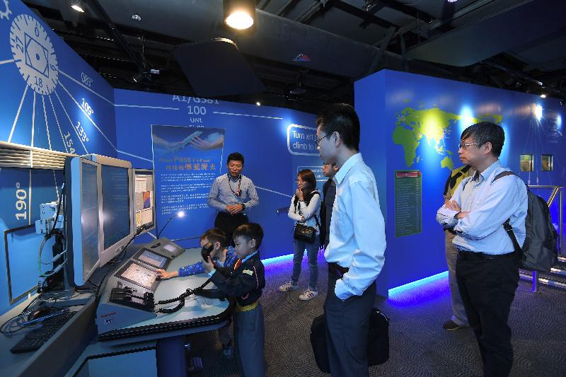 The Civil Aviation Department (CAD)'s open house event concluded successfully today (April 25). Photo shows visitors, accompanied by CAD staff, touring the Aviation Education Path to learn more about Hong Kong's aviation history, aviation security and air traffic control operations.