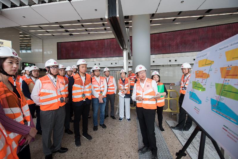 The Legislative Council Bills Committee on Guangzhou-Shenzhen-Hong Kong Express Rail Link (Co-location) Bill conducted a visit today (April 30) to West Kowloon Station on the Hong Kong Section of the Guangzhou-Shenzhen-Hong Kong Express Rail Link. Photo shows the Legislative Council Members visiting the station's facilities and receiving a briefing on the latest works progress from a representative of the MTR Corporation Limited.
