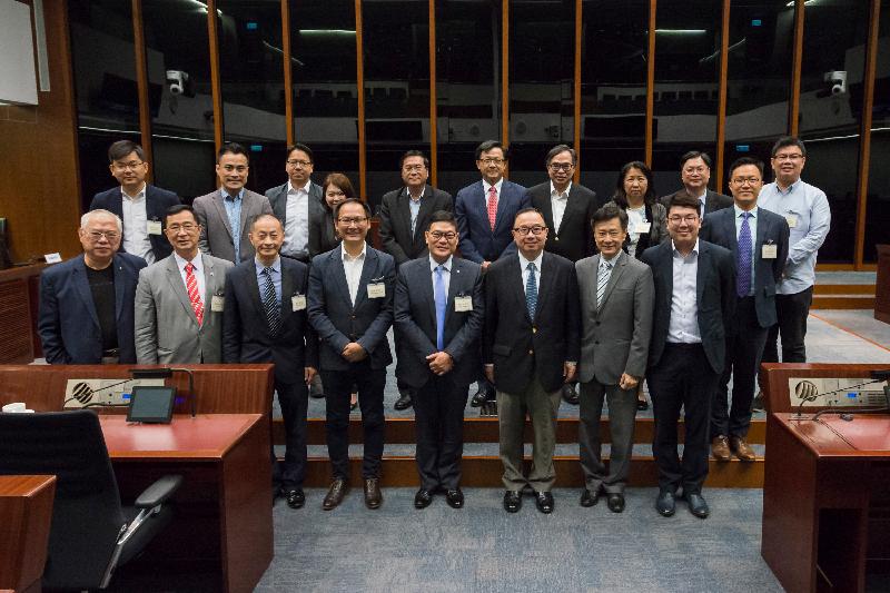 Members of the Legislative Council (LegCo) and the Central and Western District Council pose for a group photo after a meeting held in the LegCo Complex today (May 4). 