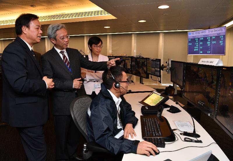 The Secretary for the Civil Service, Mr Joshua Law, visited the Marine Department today (May 9). Photo shows Mr Law (second left) being briefed on the work of the Vessel Traffic Centre.