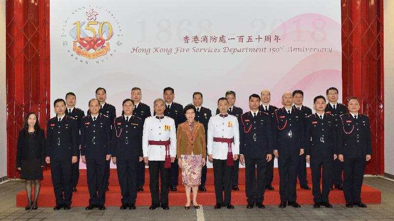 The Chief Executive, Mrs Carrie Lam (front row, center), pictures with the Director of Fire Services, Mr Li Kin-yat (front row, fifth left); the Deputy Director of Fire Services, Mr Leung Wai-hung (front row, fifth right); and senior officials of the Fire Services Department (FSD), after the Hong Kong FSD 150th anniversary grand parade at the Fire and Ambulance Services Academy today (‪May 9‬).