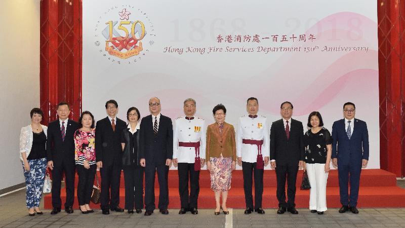The Chief Executive, Mrs Carrie Lam (fifth right), pictures with the Director of Fire Services, Mr Li Kin-yat (sixth right); the Deputy Director of Fire Services, Mr Leung Wai-hung (fourth right); former Directors of Fire Services; and other guests, after the Hong Kong Fire Services Department 150th anniversary grand parade at the Fire and Ambulance Services Academy today (‪May 9‬).