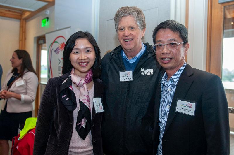 The Commissioner for Economic and Trade Affairs, USA, Mr Clement Leung (right), and the Director of Hong Kong Economic and Trade Office in New York (HKETONY), Ms Joanne Chu (left), welcome the Lieutenant Governor of Rhode Island, Mr Dan McKee, to the welcome reception hosted by the HKETONY on May 13 (Newport, Rhode Island time).