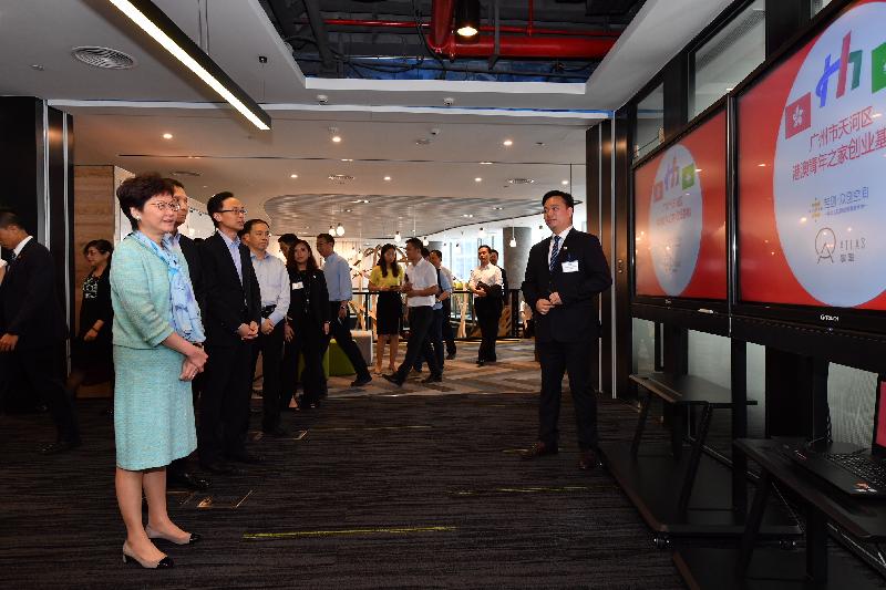 The Chief Executive, Mrs Carrie Lam (first left), visited the Guangzhou Tianhe Hong Kong and Macau Youth Association in Guangzhou today (May 17). Photo shows Mrs Lam, accompanied by the Secretary for Constitutional and Mainland Affairs, Mr Patrick Nip (third left), and the Director General of the Hong Kong and Macao Affairs Office of the People's Government of Guangdong Province, Mr Liao Jingshan (second left), receiving a briefing on the facilities and services provided for young entrepreneurs.
