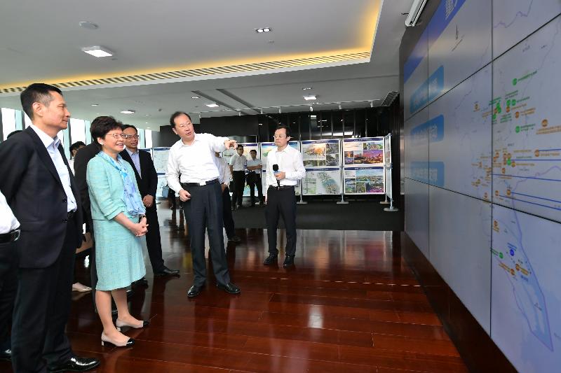 The Chief Executive, Mrs Carrie Lam (second left), visited the Pazhou Internet Innovation Cluster, which is currently being developed, in Guangzhou today (May 17). Photo shows the Secretary of the CPC Guangzhou Municipal Committee, Mr Ren Xuefeng (second right), briefing Mrs Lam on the development of the project. Looking on are the Secretary for Constitutional and Mainland Affairs, Mr Patrick Nip (third right), and the Director General of the Hong Kong and Macao Affairs Office of the People's Government of Guangdong Province, Mr Liao Jingshan (first left).
