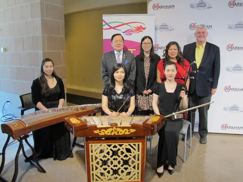 (Back row from left) Senator of the Parliament of Canada Mr Victor Oh; the Director of the Hong Kong Economic and Trade Office (Toronto), Miss Kathy Chan; Member of the Parliament of Canada, Ms Mary Ng; and the Deputy Mayor of the City of Markham, Mr Jack Heath, with (front row from left) guzheng master Cynthia Qin, yangqin master Calla Tan, and erhu master Linlin Wang at the opening ceremony of the roving exhibition in the Greater Toronto area entitled "Hong Kong: Asia's World City" held at the Markham Civic Centre on May 18 (Toronto time).