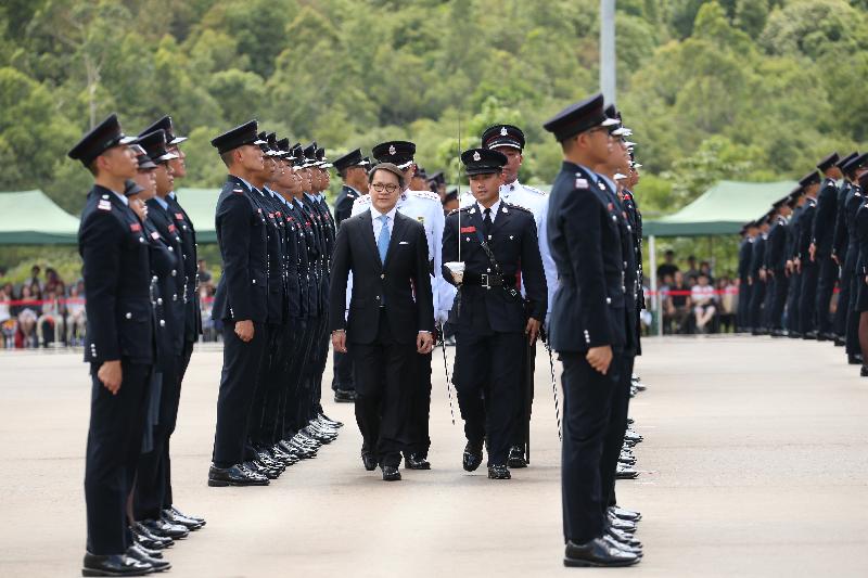 The Chairman of the Legislative Council Panel on Security, Mr Chan Hak-kan, reviews the 182nd Fire Services passing-out parade at the Fire and Ambulance Services Academy today (May 25).