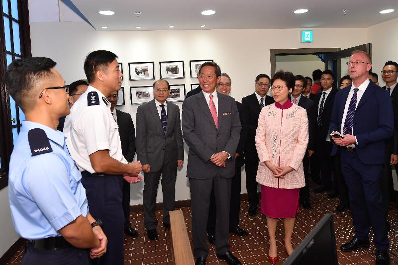 The Chief Executive, Mrs Carrie Lam, attended the Tai Kwun Opening Ceremony today (May 25). Photo shows Mrs Lam (front row, second right) visiting the Police Services Centre at Tai Kwun.