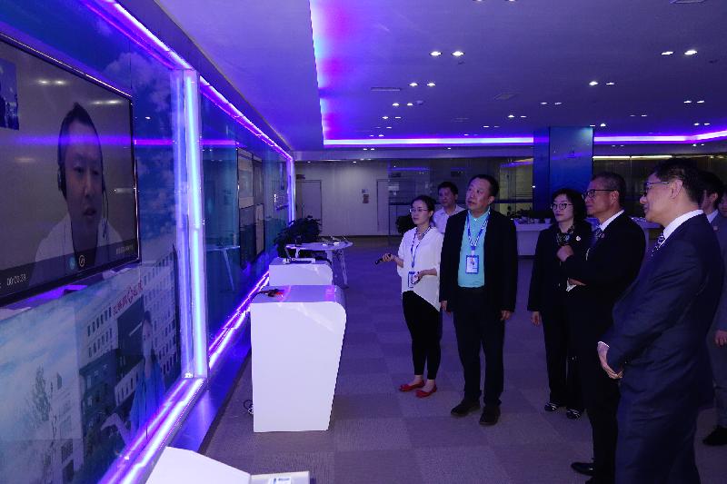 The Financial Secretary, Mr Paul Chan (second right), today (May 26) pays a visit to a high-tech enterprise in Guizhou, which has made use of big data in developing its online medical service business, to receive updates on the latest developments in the big data industry of Guizhou. Also joining are the Government Chief Information Officer, Mr Allen Yeung (first right); and the Director of the Hong Kong Economic and Trade Office in Chengdu of the Government of the Hong Kong Special Administrative Region, Miss Pamela Lam (third right).
