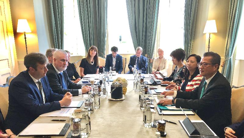 The Financial Secretary, Mr Paul Chan (first right) and the Special Representative for Hong Kong Economic and Trade Affairs to the European Union, Ms Shirley Lam (second right) attend a roundtable discussion with the Minister of State at the Department of Finance and the Department of Public Expenditure and Reform of Ireland, Mr Michael D'arcy (first left) and a group of key figures in Irish financial services today (June 1, Dublin time) in Dublin, Ireland.