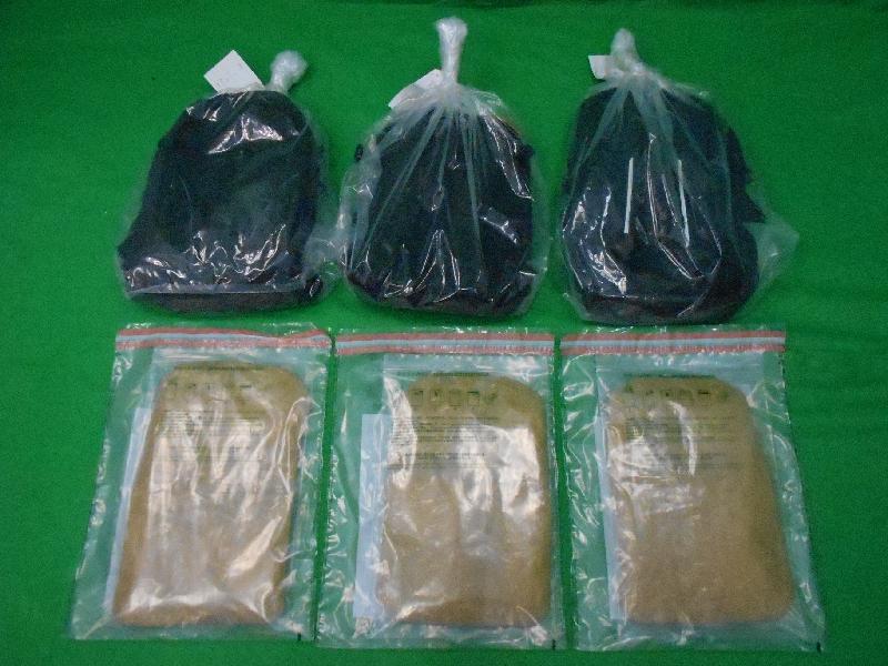 Hong Kong Customs yesterday (June 3) seized about 3 kilograms of suspected methamphetamine with an estimated market value of about $1.6 million at Hong Kong International Airport. Photo shows the suspected methamphetamine seized and the three backpacks found with the suspected methamphetamine concealed inside.