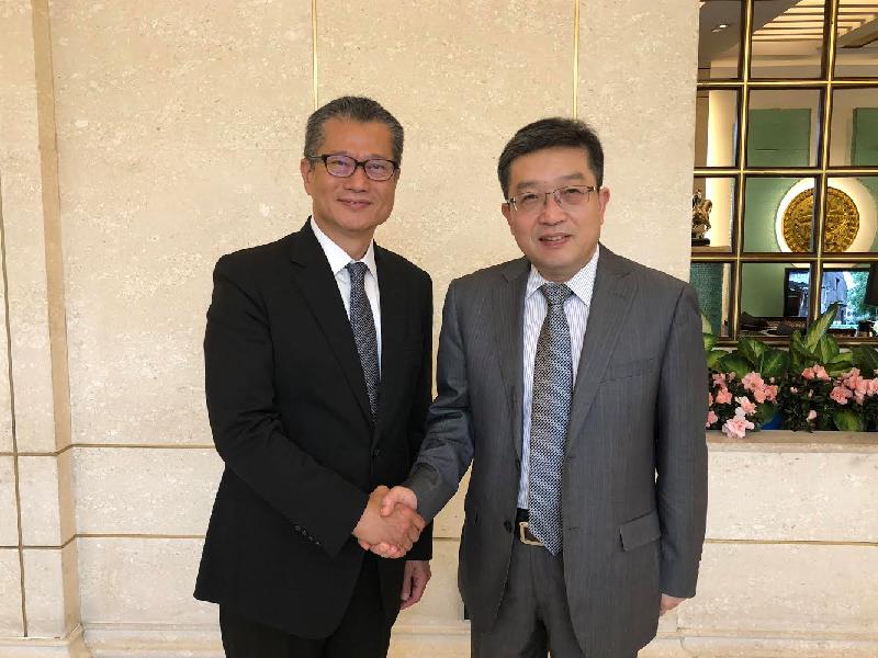 The Financial Secretary, Mr Paul Chan (left), in Shanghai today (June 7) meets with Member of the Standing Committee of the Shanghai Committee of the Chinese Communist Party and Head of the United Front Work Department of the Shanghai Committee of the Chinese Communist Party Mr Zheng Gangmiao.