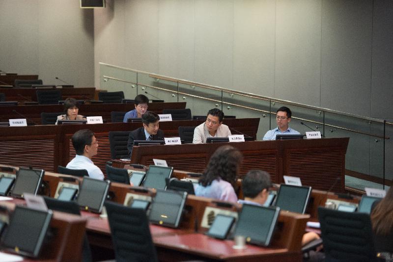 Members of the Legislative Council (LegCo) and the Yau Tsim Mong District Council exchange views on the consultation on licensing of guesthouses in the LegCo Complex today (June 8).