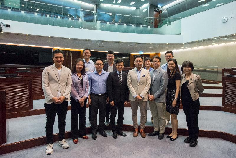 Members of the Legislative Council (LegCo) and the Yau Tsim Mong District Council in a group photo after a meeting held in the LegCo Complex today (June 8).