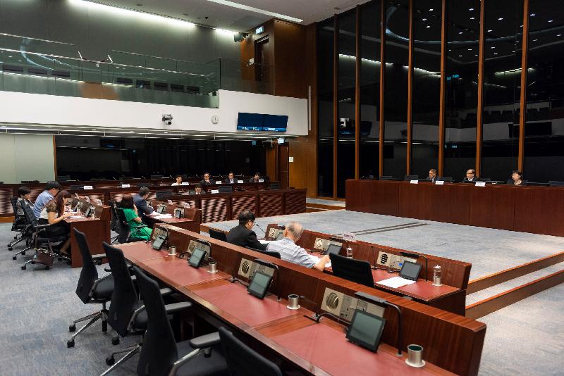 Members of the Legislative Council (LegCo) and the Islands District Council discuss the community problems arising from population increase on Lantau Island in the LegCo Complex today (June 8).