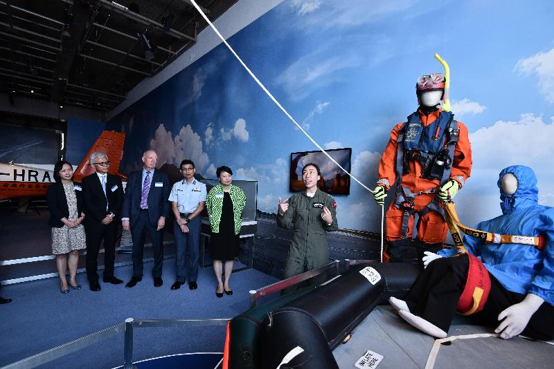 The opening ceremony for the exhibitions "Above and Beyond" and "Semper Paratus - The Government Flying Service" was held today (June 14) at the Hong Kong Science Museum. Photo shows the Acting Senior Pilot (Special Duties) of the Government Flying Service, Miss Emily Wong (right), introducing the contents of the exhibition to the officiating guests (from left) the Museum Director of the Hong Kong Science Museum, Ms Paulina Chan; the Acting Director of Leisure and Cultural Services, Dr Louis Ng; the Boeing Company's Vice President of Communications, Mr Charlie Miller; the Controller of the Government Flying Service, Captain Michael Chan; and the Permanent Secretary for Home Affairs, Mrs Cherry Tse, . 