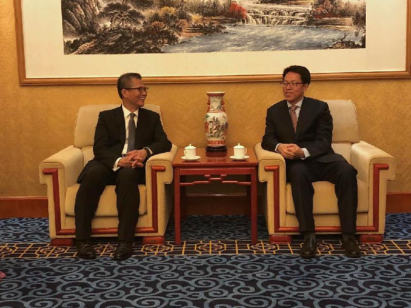 The Financial Secretary, Mr Paul Chan (left), today (June 20) calls on the Director of the Hong Kong and Macao Affairs Office of the State Council, Mr Zhang Xiaoming, in Beijing. Both parties exchanged views on issues of mutual interest.