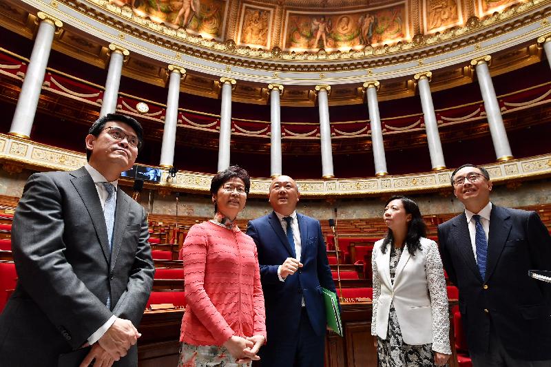 The Chief Executive, Mrs Carrie Lam, continued her visit to France in Paris today (June 20, Paris time). Photo shows Mrs Lam (second left), accompanied by the President of the France-China Friendship Group of the National Assembly, Mr Buon Huong Tan (centre); the Secretary for Commerce and Economic Development, Mr Edward Yau (first left); the Secretary for Innovation and Technology, Mr Nicholas W Yang (first right), and the Special Representative for Hong Kong Economic and Trade Affairs to the European Union, Ms Shirley Lam (second right) touring the National Assembly of France.