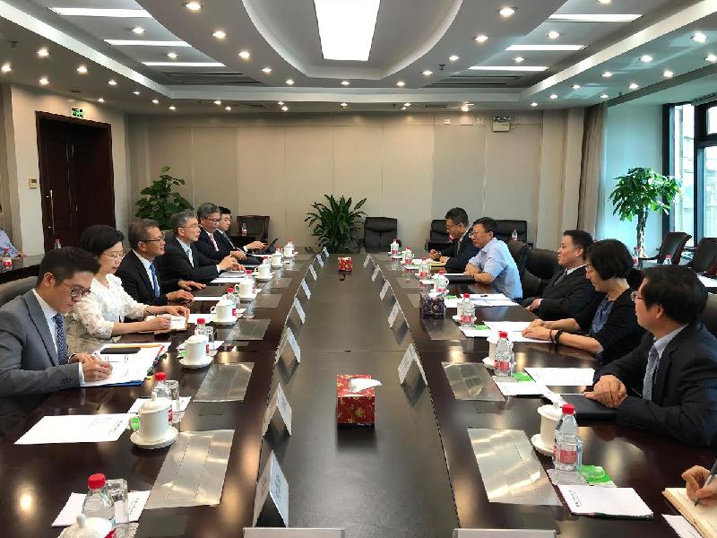 The Financial Secretary, Mr Paul Chan (third left), today (June 21) meets with the Deputy Governor of the People's Bank of China, Mr Pan Gongsheng (third right), in Beijing. Also present are the Secretary for Financial Services and the Treasury, Mr James Lau (fourth left); the Deputy Chief Executive of the Hong Kong Monetary Authority, Mr Arthur Yuen (fifth left); and the Director of the Office of the Government of the Hong Kong Special Administrative Region in Beijing, Ms Gracie Foo (second left).