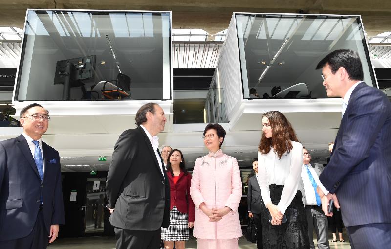 The Chief Executive, Mrs Carrie Lam, continued her visit to France in Paris today (June 21, Paris time). Photo shows Mrs Lam (third right), accompanied by the Secretary for Innovation and Technology, Mr Nicholas W Yang (first left), and the Secretary for Commerce and Economic Development, Mr Edward Yau (first right), touring business incubator for start-ups, Station F, while being briefed by the President of Station F, Mr Xavier Niel (second left), on its operations and facilities.