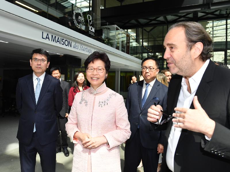 The Chief Executive, Mrs Carrie Lam, continued her visit to France in Paris today (June 21, Paris time). Photo shows Mrs Lam (third right), accompanied by the Secretary for Innovation and Technology, Mr Nicholas W Yang (second right), and the Secretary for Commerce and Economic Development, Mr Edward Yau (first left), touring business incubator for start-ups, Station F, while being briefed by the President of Station F, Mr Xavier Niel (first right), on its operations and facilities.