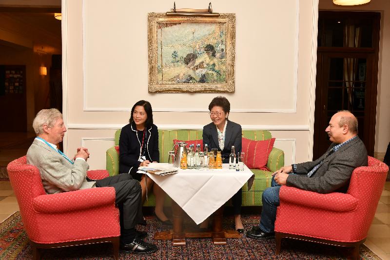 The Chief Executive, Mrs Carrie Lam, continued to attend the Lindau Nobel Laureate Meeting today (June 25, Lindau time). Photo shows Mrs Lam (second right), accompanied by the Head of the Policy Innovation and Co-ordination Office, Mrs Betty Fung (second left), meeting with Professor Bruce Beutler (first right) and Professor Jules Hoffmann (first left), who are laureates of both the Nobel and Shaw Prizes.