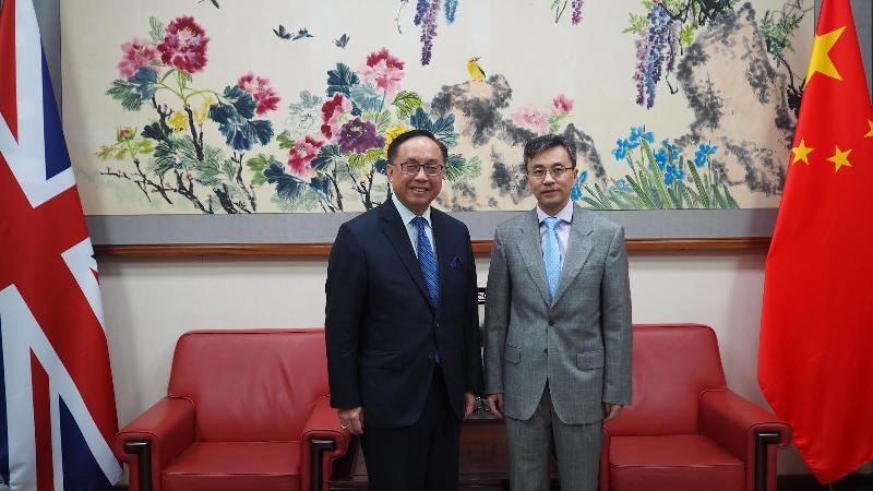 The Secretary for Innovation and Technology, Mr Nicholas W Yang (left), calls on the Acting Chinese Ambassador of the People's Republic of China to the United Kingdom, Mr Zhu Qin (right), in London today (June 25, London time).