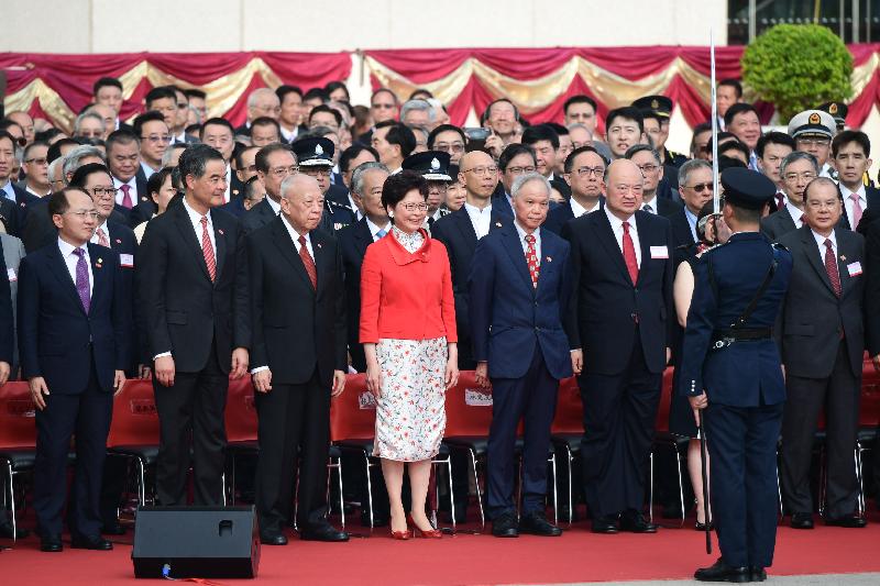The Chief Executive, Mrs Carrie Lam (front row, fourth left), and her husband Dr Lam Siu-por (front row, fifth left); the Chief Justice of the Court of Final Appeal, Mr Geoffrey Ma Tao-li (front row, third right); Vice Chairman of the National Committee of the Chinese People's Political Consultative Conference (CPPCC) Mr Tung Chee Hwa (front row, third left); Vice Chairman of the National Committee of the CPPCC Mr C Y Leung (front row, second left); the Chief Secretary for Administration, Mr Matthew Cheung Kin-chung (front row, first right); the Director of the Liaison Office of the Central People's Government in the Hong Kong Special Administrative Region, Mr Wang Zhimin (front row, first left), together with Principal Officials and guests, attend the flag-raising ceremony for the 21st anniversary of the establishment of the Hong Kong Special Administrative Region at Golden Bauhinia Square in Wan Chai this morning (July 1).