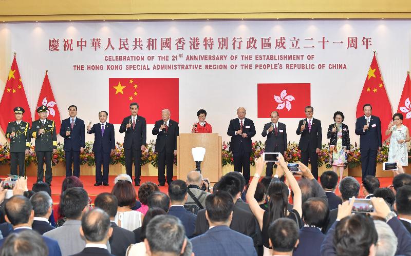 The Chief Executive, Mrs Carrie Lam (centre), and officiating guests (from left) the Political Commissar of the Chinese People's Liberation Army Hong Kong Garrison, Mr Cai Yongzhong; the Commander-in-chief of the Chinese People's Liberation Army Hong Kong Garrison, Mr Tan Benhong; the Commissioner of the Ministry of Foreign Affairs of the People's Republic of China in the Hong Kong Special Administrative Region (HKSAR), Mr Xie Feng; the Director of the Liaison Office of the Central People's Government in the HKSAR, Mr Wang Zhimin; Vice Chairman of the National Committee of the Chinese People's Political Consultative Conference (CPPCC) Mr C Y Leung; Vice Chairman of the National Committee of the CPPCC Mr Tung Chee Hwa; the Chief Justice of the Court of Final Appeal, Mr Geoffrey Ma Tao-li; the Chief Secretary for Administration, Mr Matthew Cheung Kin-chung; the Financial Secretary, Mr Paul Chan; the Secretary for Justice, Ms Teresa Cheng, SC;  the President of the Legislative Council, Mr Andrew Leung; and Non-official Member of the Executive Council Mrs Laura Cha, propose a toast at the reception for the 21st anniversary of the establishment of the HKSAR at the Hong Kong Convention and Exhibition Centre this morning (July 1).